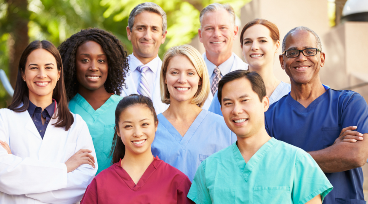 Group of healthcare professionals (HCPs) standing together and smiling